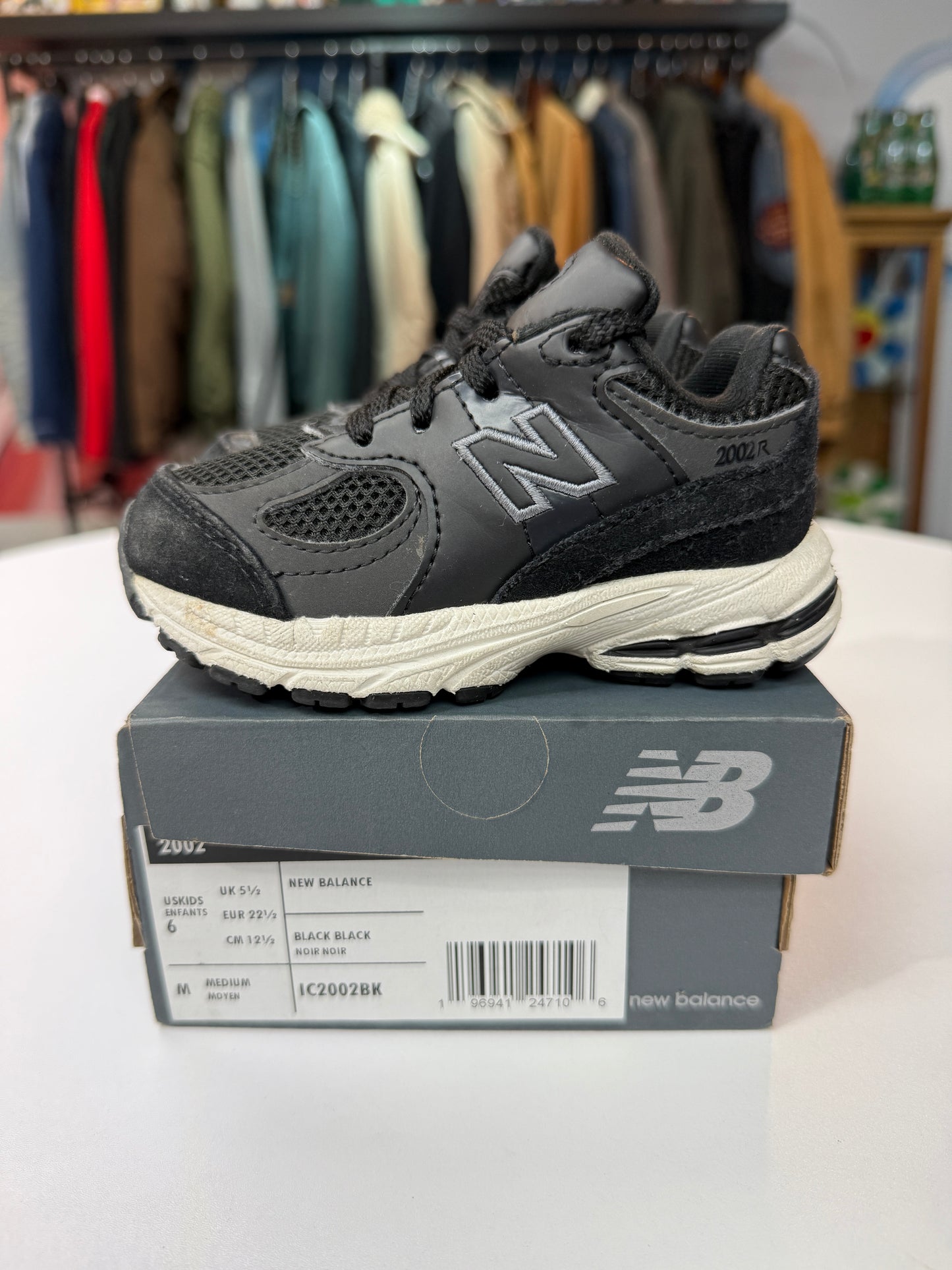Preowned Black New Balance 2002R