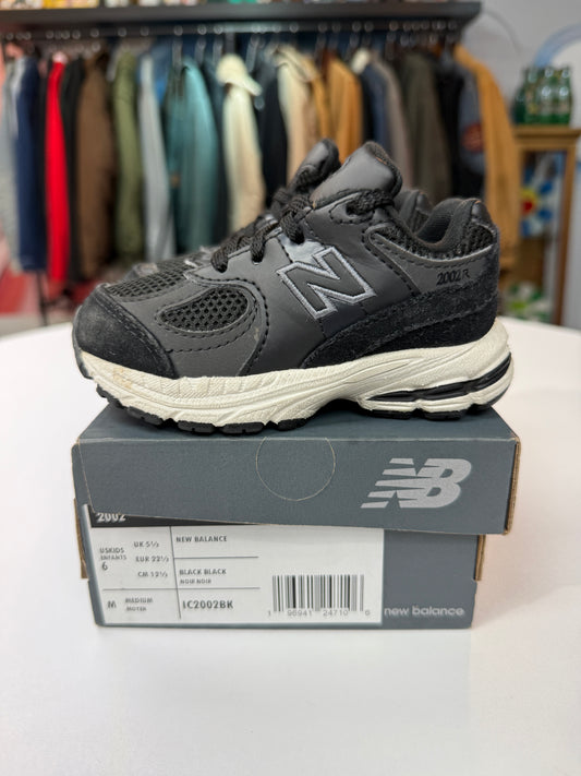 Preowned Black New Balance 2002R